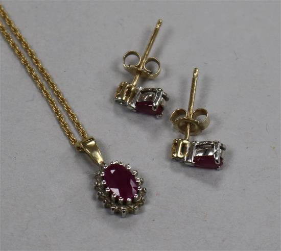 A 9ct gold, ruby and diamond suite of jewellery, comprising pendant on chain and pair of ear studs.